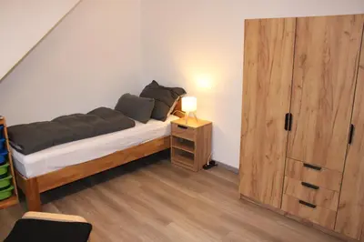 Ein Bett oder Betten in einem Zimmer der Unterkunft FeWo Oberhausen-Styrum