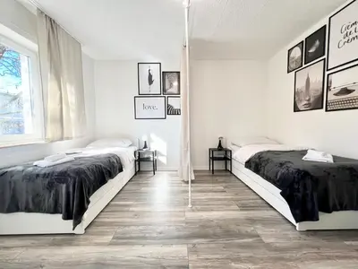 Ein Bett oder Betten in einem Zimmer der Unterkunft PrimeTime Suite für 4 mit Küche, WIFI und Parkplatz