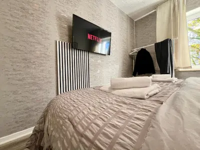 Ein Bett oder Betten in einem Zimmer der Unterkunft PrimeTime Suite für 4 mit Küche, WIFI und Parkplatz