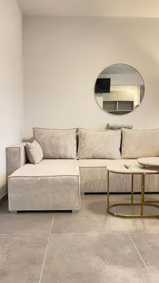 Ein Sitzbereich in der Unterkunft Home Apartments Four
