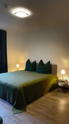 Ein Bett oder Betten in einem Zimmer der Unterkunft Home Apartments Four