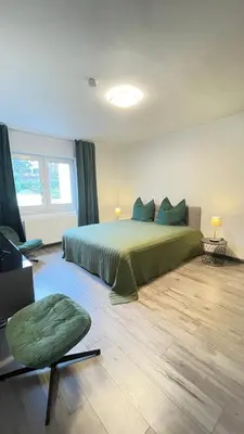 Ein Bett oder Betten in einem Zimmer der Unterkunft Home Apartments Four