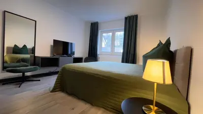 Ein Bett oder Betten in einem Zimmer der Unterkunft Home Apartments Four