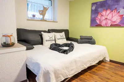 Ein Bett oder Betten in einem Zimmer der Unterkunft Moderner Appartment Zentrumnah