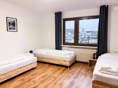 Ein Bett oder Betten in einem Zimmer der Unterkunft T&K Apartments - Duisburg - 1-3 Zimmer Apartments