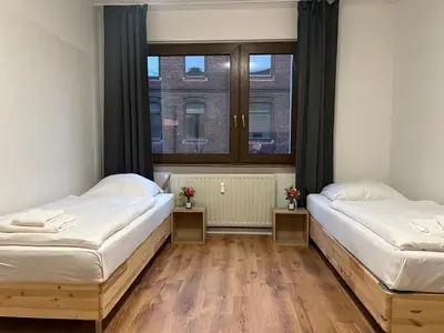 Ein Bett oder Betten in einem Zimmer der Unterkunft T&K Apartments - Duisburg - 1-3 Zimmer Apartments