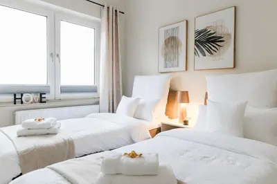 Ein Bett oder Betten in einem Zimmer der Unterkunft Design Apartment - Küche - Komfort - Zentral