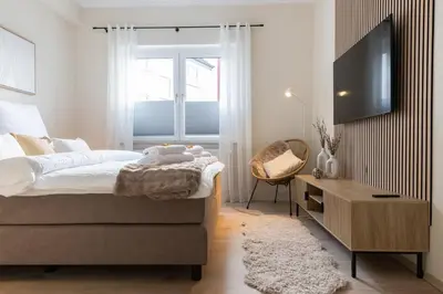 Ein Bett oder Betten in einem Zimmer der Unterkunft Design Apartment - Küche - Komfort - Zentral