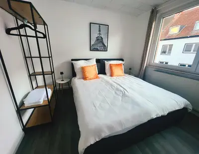 Ein Bett oder Betten in einem Zimmer der Unterkunft Wohngut City Appartement 4 für 1-4 Personen inklusive Parkplatz
