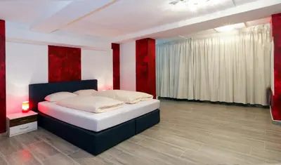 Ein Bett oder Betten in einem Zimmer der Unterkunft Hotel Alte Fabrik