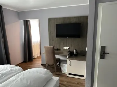 Ein Bett oder Betten in einem Zimmer der Unterkunft Hotel Restaurant Mirena