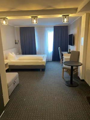 Ein Bett oder Betten in einem Zimmer der Unterkunft Hotel Restaurant Mirena