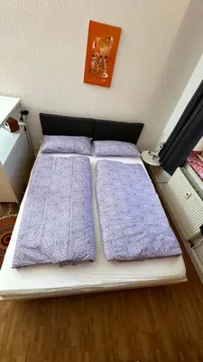 Ein Bett oder Betten in einem Zimmer der Unterkunft Frisch renovierte Ferienwohnung Abendrot für 2 Personen, zentral gelegen