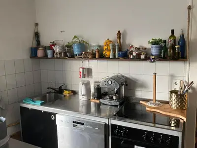 Küche/Küchenzeile in der Unterkunft Gemütliche und mit Charme eingerichtete Wohnung