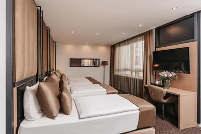 Ein Bett oder Betten in einem Zimmer der Unterkunft Hotel Unique Majestic