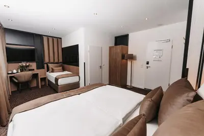 Ein Bett oder Betten in einem Zimmer der Unterkunft Hotel Unique Majestic