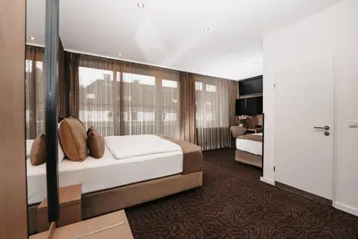 Ein Bett oder Betten in einem Zimmer der Unterkunft Hotel Unique Majestic