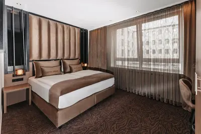 Ein Bett oder Betten in einem Zimmer der Unterkunft Hotel Unique Majestic