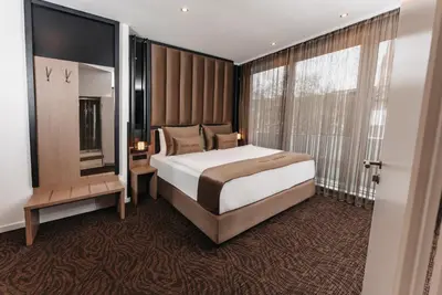 Ein Bett oder Betten in einem Zimmer der Unterkunft Hotel Unique Majestic