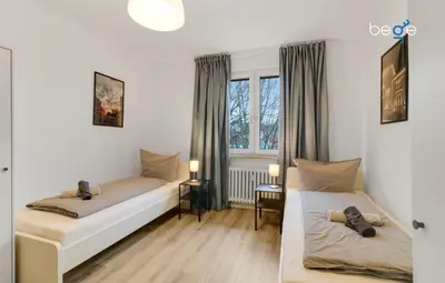 Ein Bett oder Betten in einem Zimmer der Unterkunft BEGE APARTMENTS BusinessTranquil