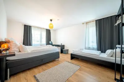 Ein Bett oder Betten in einem Zimmer der Unterkunft Urbaner Komfort und beste Lage in Wuppertal Barmen - BLNM APARTMENTS