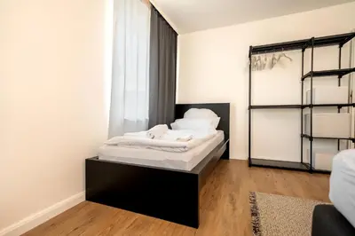 Ein Bett oder Betten in einem Zimmer der Unterkunft Urbaner Komfort und beste Lage in Wuppertal Barmen - BLNM APARTMENTS