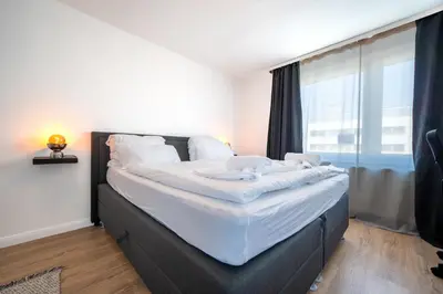 Ein Bett oder Betten in einem Zimmer der Unterkunft Urbaner Komfort und beste Lage in Wuppertal Barmen - BLNM APARTMENTS