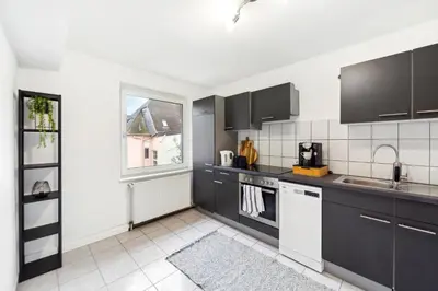 Küche/Küchenzeile in der Unterkunft Urbaner Komfort und beste Lage in Wuppertal Barmen - BLNM APARTMENTS