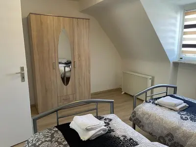 Ein Bett oder Betten in einem Zimmer der Unterkunft POLAT Apartments 6