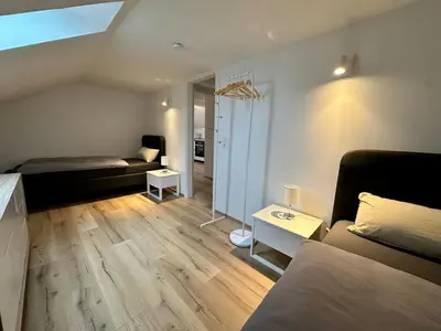 Ein Bett oder Betten in einem Zimmer der Unterkunft Helle 2-Zimmer Ferienwohnung mit 4 Betten, Nähe Innenstadt in ruhiger Lage