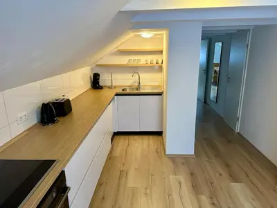Küche/Küchenzeile in der Unterkunft Helle 2-Zimmer Ferienwohnung mit 4 Betten, Nähe Innenstadt in ruhiger Lage