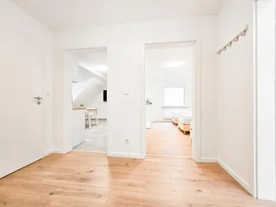 Ein Bett oder Betten in einem Zimmer der Unterkunft Tolstov Apartments - Monteurwohnung mit 3 Zimmern - Dachgeschoss - Parkplatz