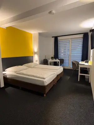 Ein Bett oder Betten in einem Zimmer der Unterkunft Hotel U Mülheim Free Parking Highspeed WiFi