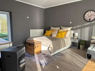 Ein Bett oder Betten in einem Zimmer der Unterkunft Authentic Travellers Suite in ehemaliger Gärtnerei
