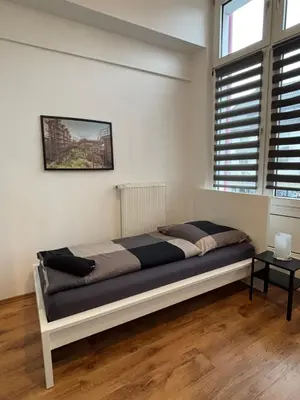 Ein Bett oder Betten in einem Zimmer der Unterkunft Case Four Boardinghouse mit Parkplatz, Küche, Waschmaschine und Trockner