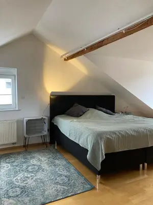 Ein Bett oder Betten in einem Zimmer der Unterkunft Moderne Wohnung mit offenem Wohnkonzept - Hagen Emst