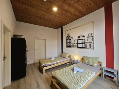 Ein Bett oder Betten in einem Zimmer der Unterkunft homes of ruhr - Monteurwohnung Meißel