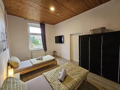 Ein Bett oder Betten in einem Zimmer der Unterkunft homes of ruhr - Monteurwohnung Meißel