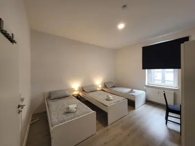 Ein Bett oder Betten in einem Zimmer der Unterkunft homes of ruhr - Monteurwohnung Hammer