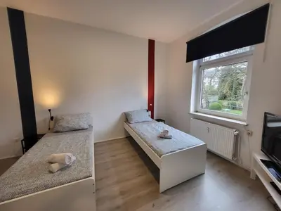 Ein Bett oder Betten in einem Zimmer der Unterkunft homes of ruhr - Monteurwohnung Hammer