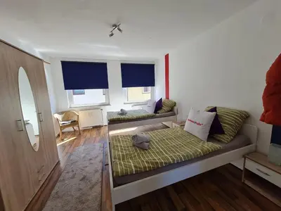 Ein Bett oder Betten in einem Zimmer der Unterkunft homes of ruhr - Appartement Wasserturm