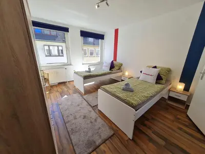 Ein Bett oder Betten in einem Zimmer der Unterkunft homes of ruhr - Appartement Wasserturm