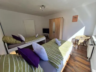Ein Bett oder Betten in einem Zimmer der Unterkunft homes of ruhr - Appartement Wasserturm