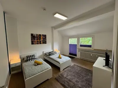 Ein Bett oder Betten in einem Zimmer der Unterkunft homes of ruhr - Monteurwohnung Grillo