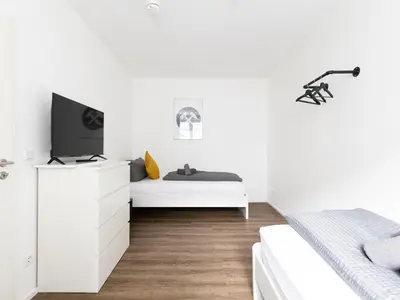 Ein Bett oder Betten in einem Zimmer der Unterkunft 2 BR with free parking and terrace