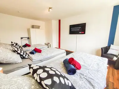 Ein Bett oder Betten in einem Zimmer der Unterkunft homes of ruhr- Monteurwohnung Pilsken