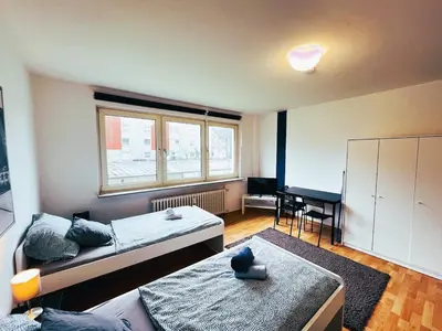 Ein Bett oder Betten in einem Zimmer der Unterkunft homes of ruhr - Monteurwohnung Förderturm