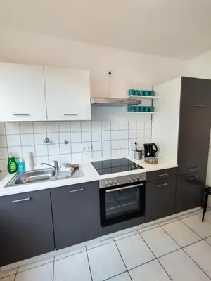 Küche/Küchenzeile in der Unterkunft homes of ruhr - Monteurwohnung Pütt
