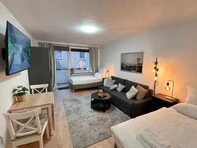 Ein Bett oder Betten in einem Zimmer der Unterkunft City Apartment with 2 individual beds and sleeping sofa and kitchen