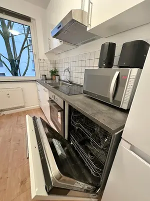 Küche/Küchenzeile in der Unterkunft City Apartment with 2 individual beds and sleeping sofa and kitchen